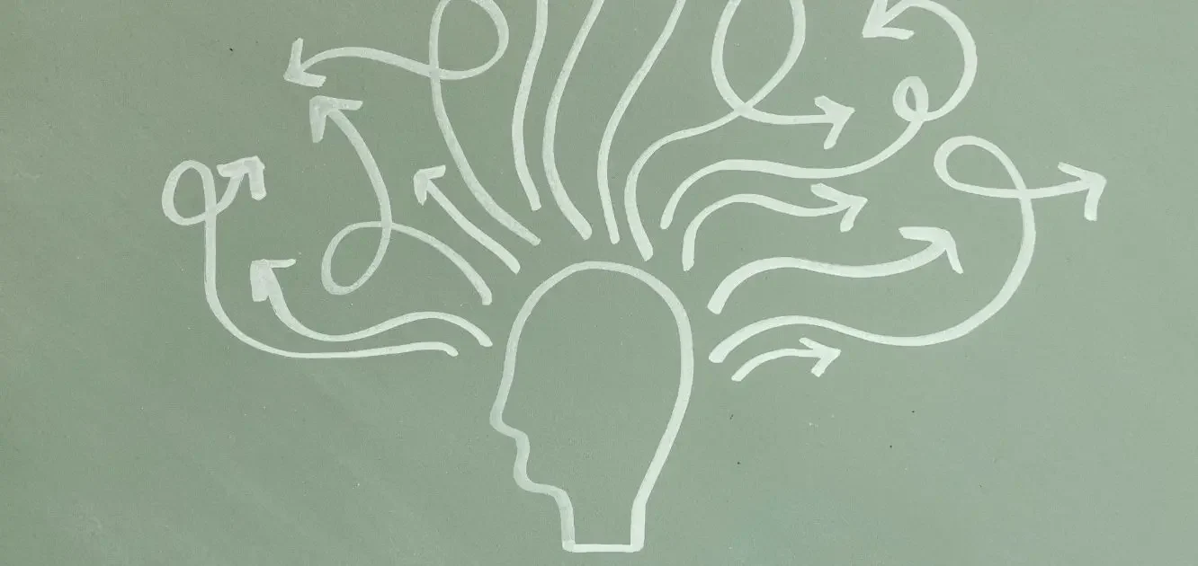 Illustration of a head with various arrows and lines representing thoughts and ideas.